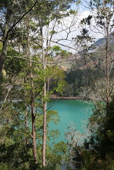 Volcanic colorful lake (Telaga Warna) on Dieng plateau, Java, Indonesia