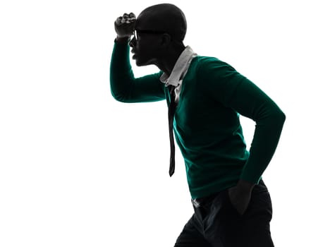 one african  black man looking away worried  in silhouette studio on white background