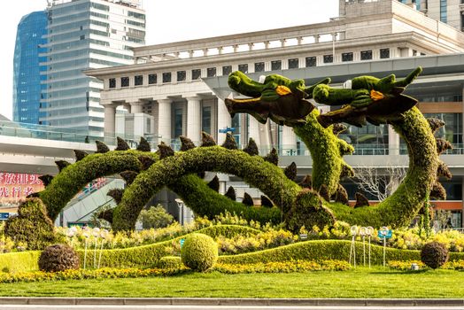 Shanghai, China - April 7, 2013: dragons sculptured trees in pudong  at the city of Shanghai in China on april 7th, 2013
