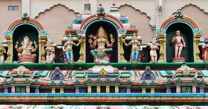 Traditonal Gods sculpture on Indian temple facade in Kuala Lumpur, Malaysia.  Sri Mahamariamman Temple. 