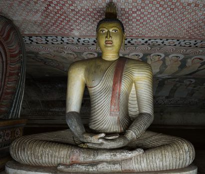 Ancient Buddha statue image in Dambulla Rock Temple caves, Sri Lanka 