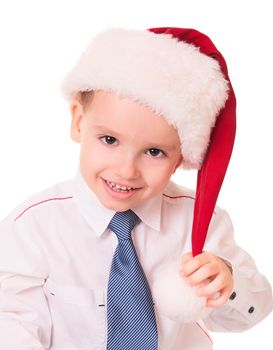 Little funny kid in red Christmas santa hat on white background