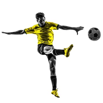 one brazilian soccer football player young man kicking in silhouette studio  on white background