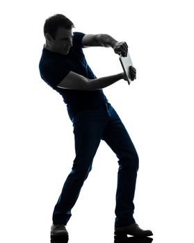 one caucasian man gaming video game digital tablet   in silhouette on white background