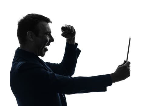 one caucasian business man holding digital tablet  happy joy   in silhouette on white background