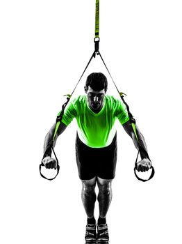 one caucasian man exercising   suspension training  trx   on white background