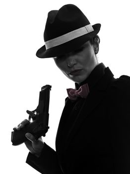 one stylish caucasian woman in suit holding gun in silhouette  on white background