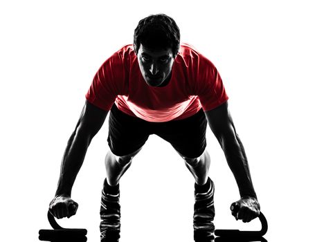 one  man exercising fitness workout push ups  in silhouette  on white background