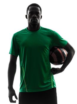 one african man soccer player green jersey holding football  in silhouette  on white background