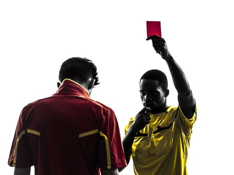 two men soccer player and referee showing red card in silhouette  on white background