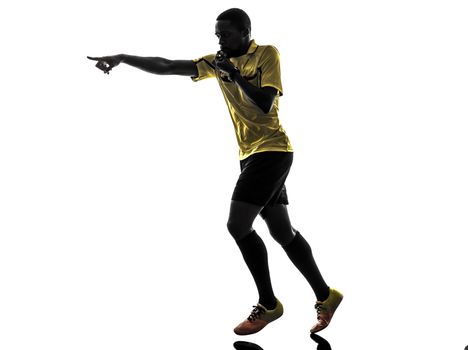 one african man referee  running whistling in silhouette  on white background
