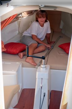 Boy in the cabin yacht .