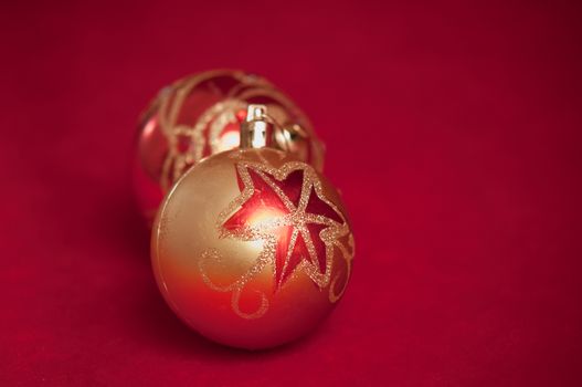 Varicoloured christmas balls on red  background  .