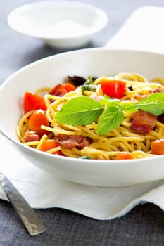 Spaghetti with bacon,tomato and dried chilli