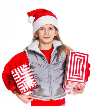 Christmas theme - Smiling cute girl in Santa's hat with gift box, isolated on white