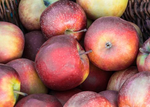 Wicker basket with red apples