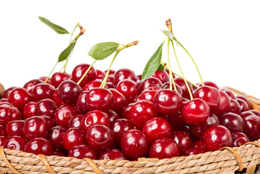 Sweet cherry in basket isolated on white background