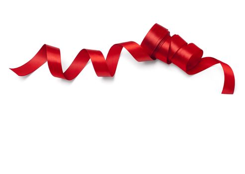 Shiny red satin ribbon on white background