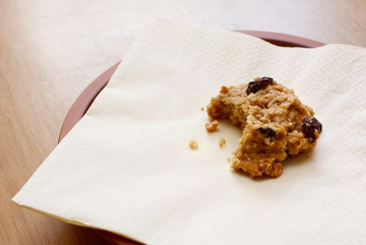 Delicious oatmeal raisin cookie with a bite taken