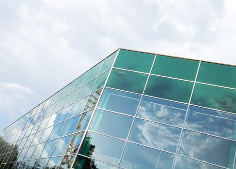 glass windows of a modern building with reflections and glare