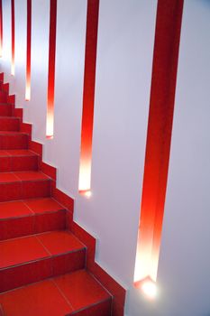 wall of a modern building with lights and niches and red stage