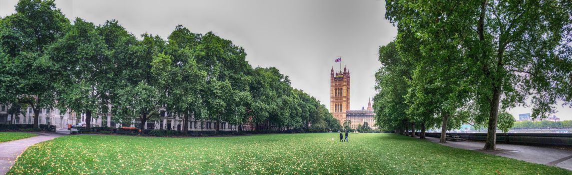 London. Victoria Gardens and Palace of Westminster.