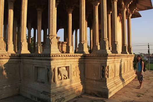 Young woman standing at 84-Pillared Cenotaph, Bundi, Rajasthan, India