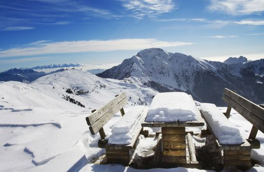 Bench in winter landscape