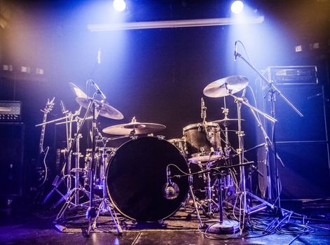 Drumkit on empty stage waiting for musicians (logo removed)