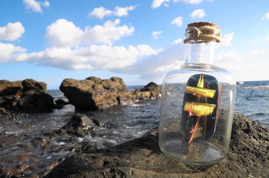 Ancient Spanish Sailing Boat in a Bottle near the Ocean