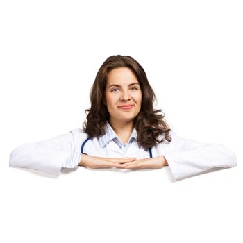 Young attractive female doctor put her hands on the blank banner, place for text