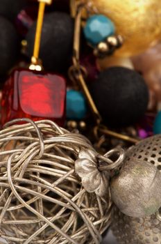 Background of Various Jewelry with Ruby Necklace, Bronze Bracelet and Gem Beads closeup