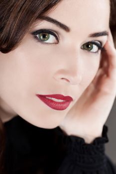 Close-up portrait of a beautiful middle aged woman with beautiful red lips