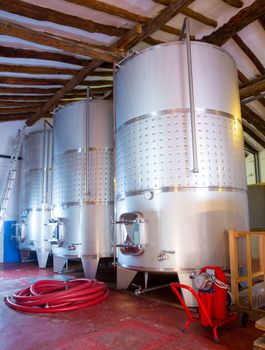 Stainless steel fermentation tanks vessels indoor of mediterranean winery