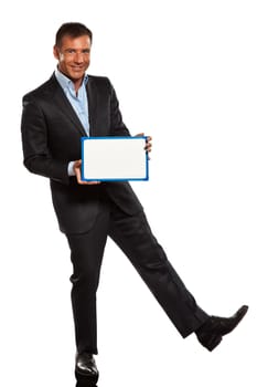 one caucasian business man holding showing whiteboard full length in studio isolated on white background
