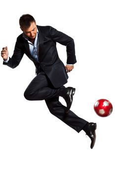 one caucasian business man playing juggling soccer ball in studio isolated on white background