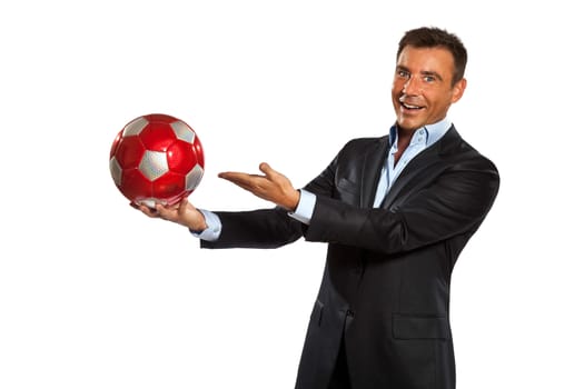 one caucasian business man holding showing soccer ball in studio isolated on white background