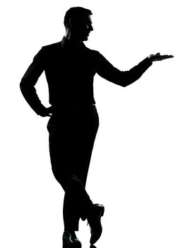 one caucasian business man silhouette standing hand open  Full length in studio isolated on white background