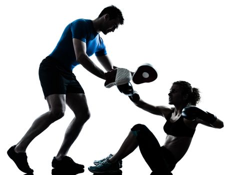 one caucasian couple man woman personal trainer coach man woman boxing training silhouette studio isolated on white background