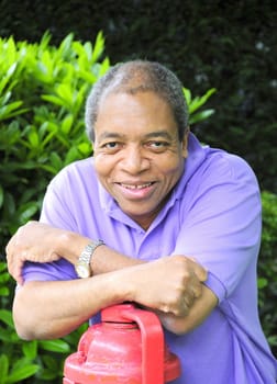 African American male posing outside.