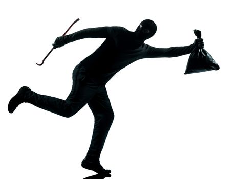 thief criminal running in silhouette studio isolated on white background in silhouette studio isolated on white background