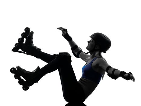 one caucasian woman in roller skates  falling silhouette studio isolated on white background