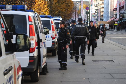 Norwegian police cars and norwegian police officers.