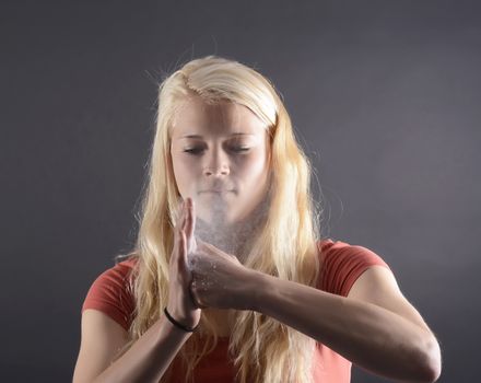 angry young blond woman boxing