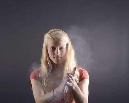 beautiful young blond woman applauding