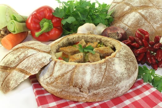 a farmhouse bread stuffed with a colorful bread soup