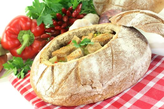 a farmhouse bread stuffed with a colorful bread soup