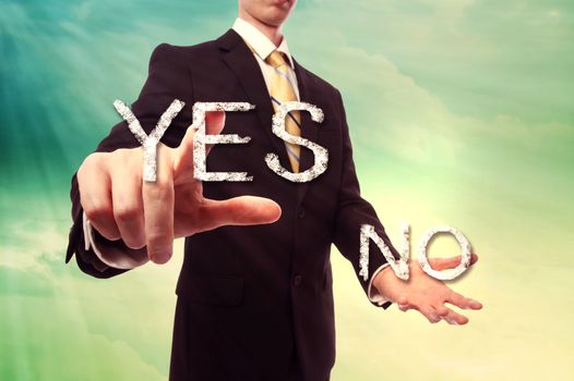 Businessman pointing YES over turquoise yellow colored sky background