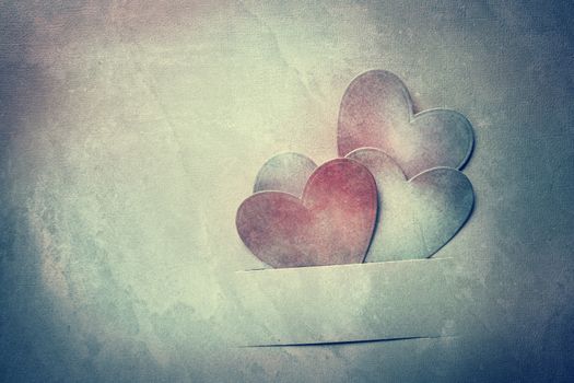 Handcrafted paper hearts in vintage desaturated tone