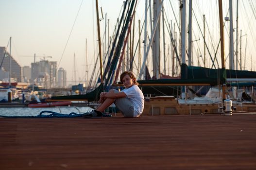 Portrait of a boy on the docks at the yacht club in Tel Aviv.